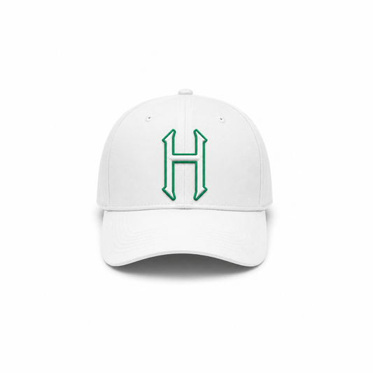 White baseball cap with embroidered green H patch on front panel