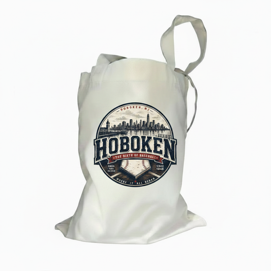 Natural canvas tote bag with Hoboken Birth of Baseball circular badge graphic