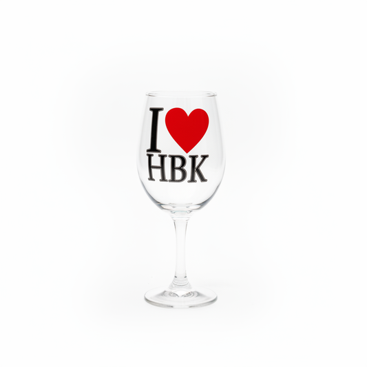 I Love HBK clear stemmed wine glass with red heart graphic on white background